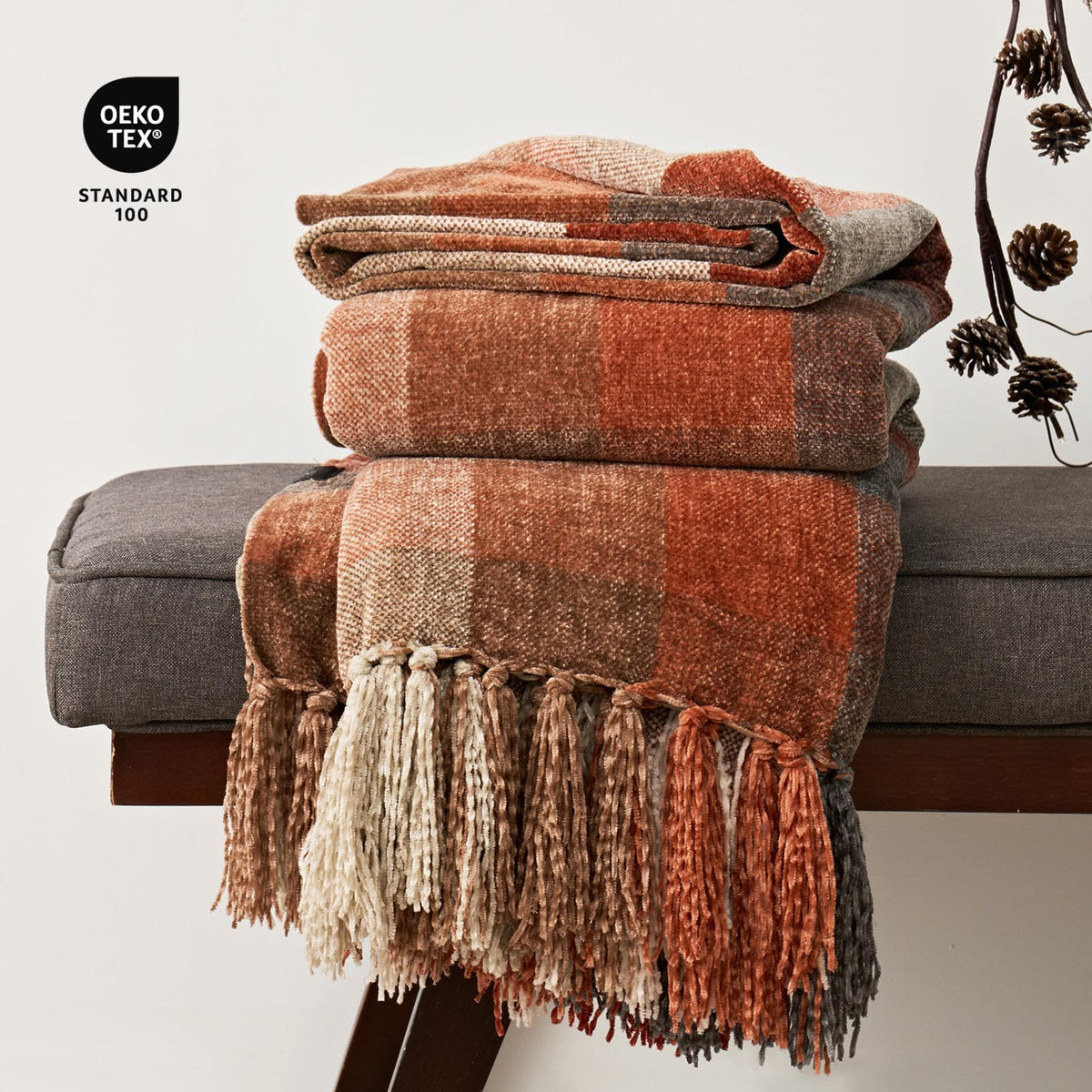 EverGrace lightweight throw draped over bed for year-round, breathable warmth.