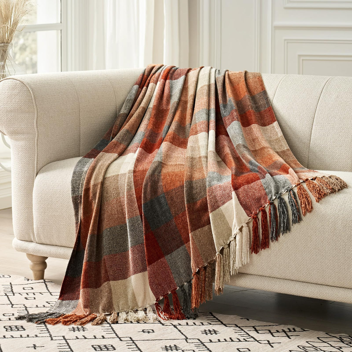 EverGrace plaid chenille throw blanket on a sofa adds cozy style and warmth.