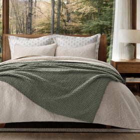 Evergracehome lightweight warm year-round blanket draped over a sofa.