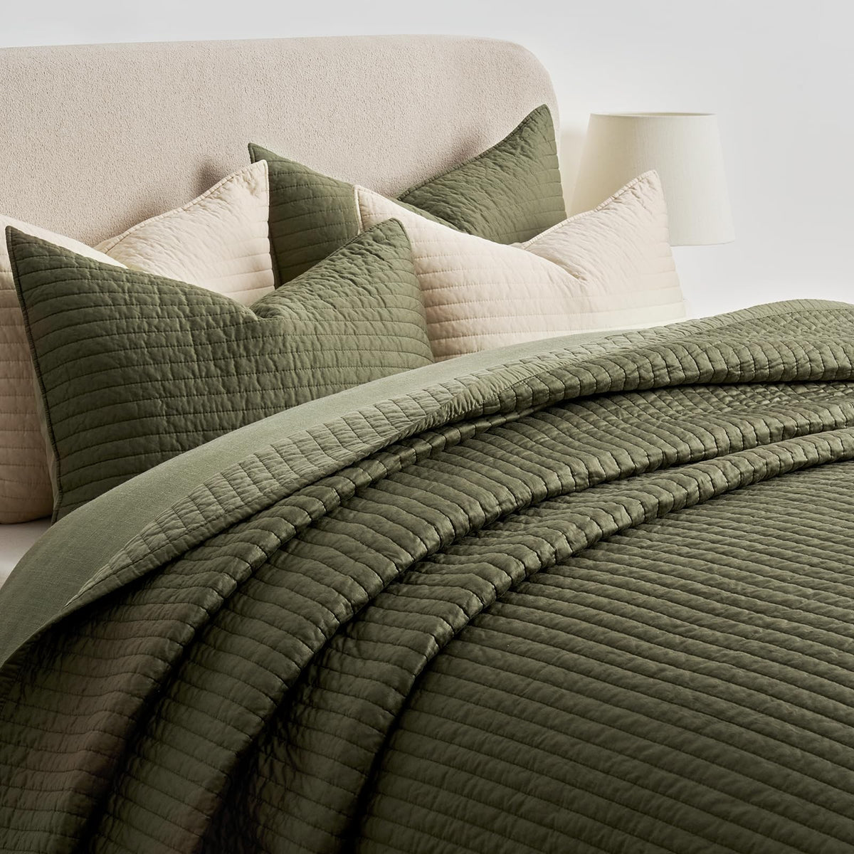 EVERGRACEHOME bed display with olive-green hue complements modern bedroom decor.
