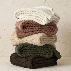 EVERGRACEHOME throw draped over a chair, cocoa brown tone enhances cozy farmhouse décor.