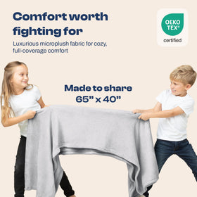 EverSnug blanket clipped to backpack for hands-free comfort during travel.