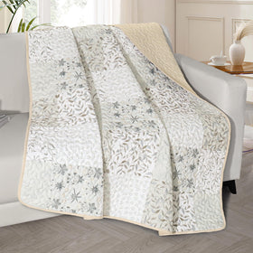 Exclusivo Mezcla boho patchwork throw 50x60 adds cozy warmth to a couch.