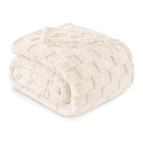 Exclusivo Mezcla king size ivory flannel blanket offers cloud-soft warmth for cool evenings