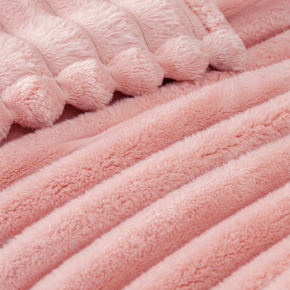 Exclusivo Mezcla blanket on bed showcases lightweight, cozy coverlet