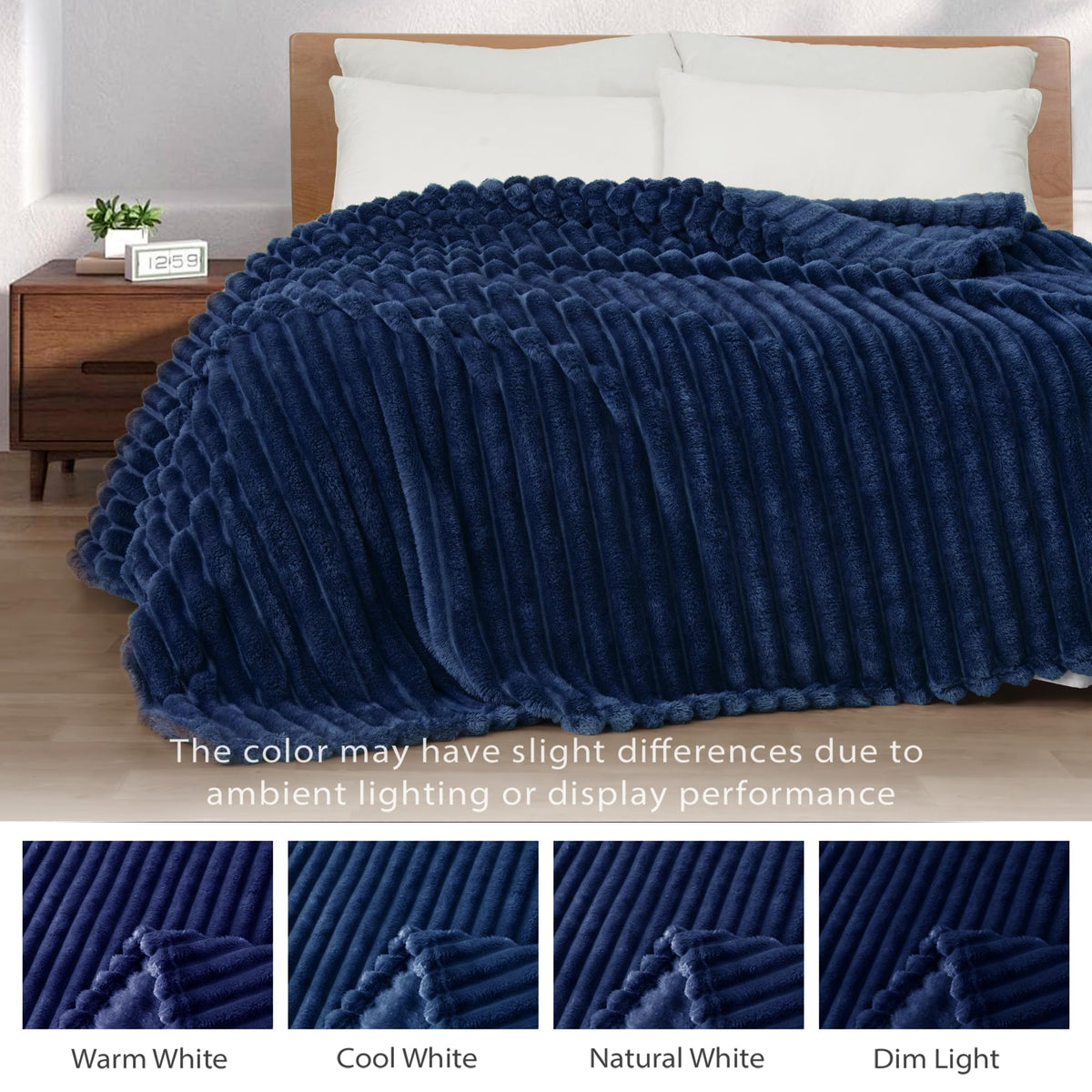 Navy Exclusivo Mezcla blanket adds year-round warmth to a bed