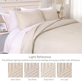 Exclusivo Mezcla quilt shows geometry pattern on both sides for versatile decor.