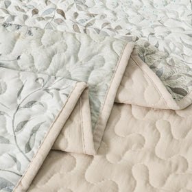 Exclusivo Mezcla reversible grey throw offers two looks for bed or sofa.