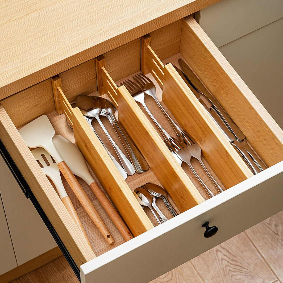 Fabsome bamboo drawer dividers with spring for secure hold.