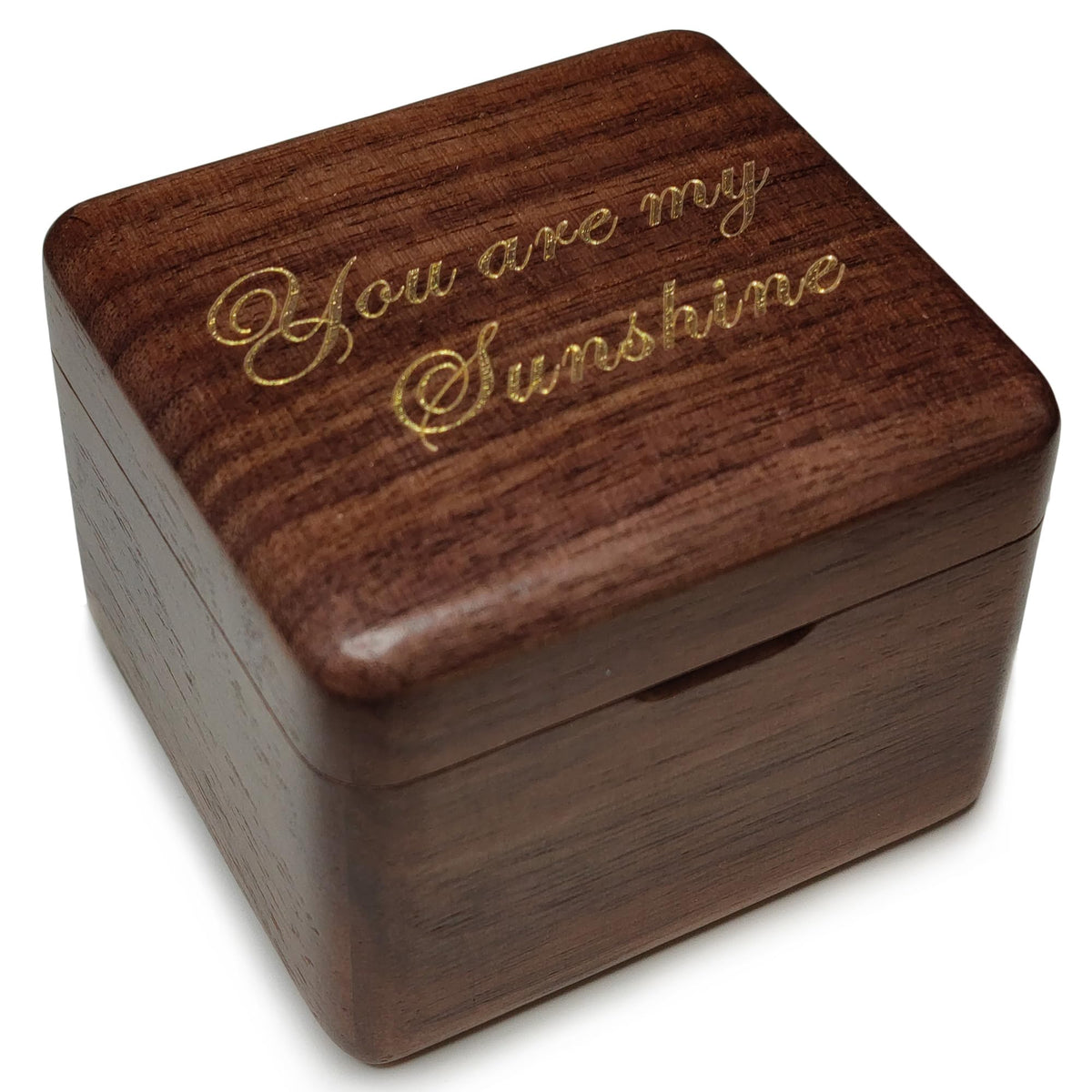 Falado walnut wood music box cover showing natural grain and craftsmanship.