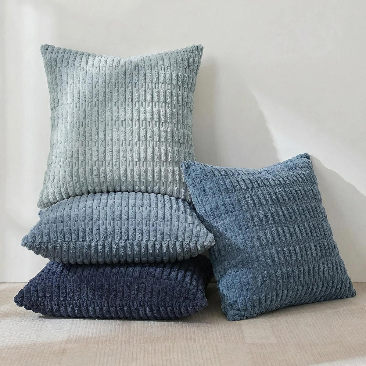 Fancy Homi blue-striped decorative pillow cover enhances sofa style with easy-care, durable fabric.