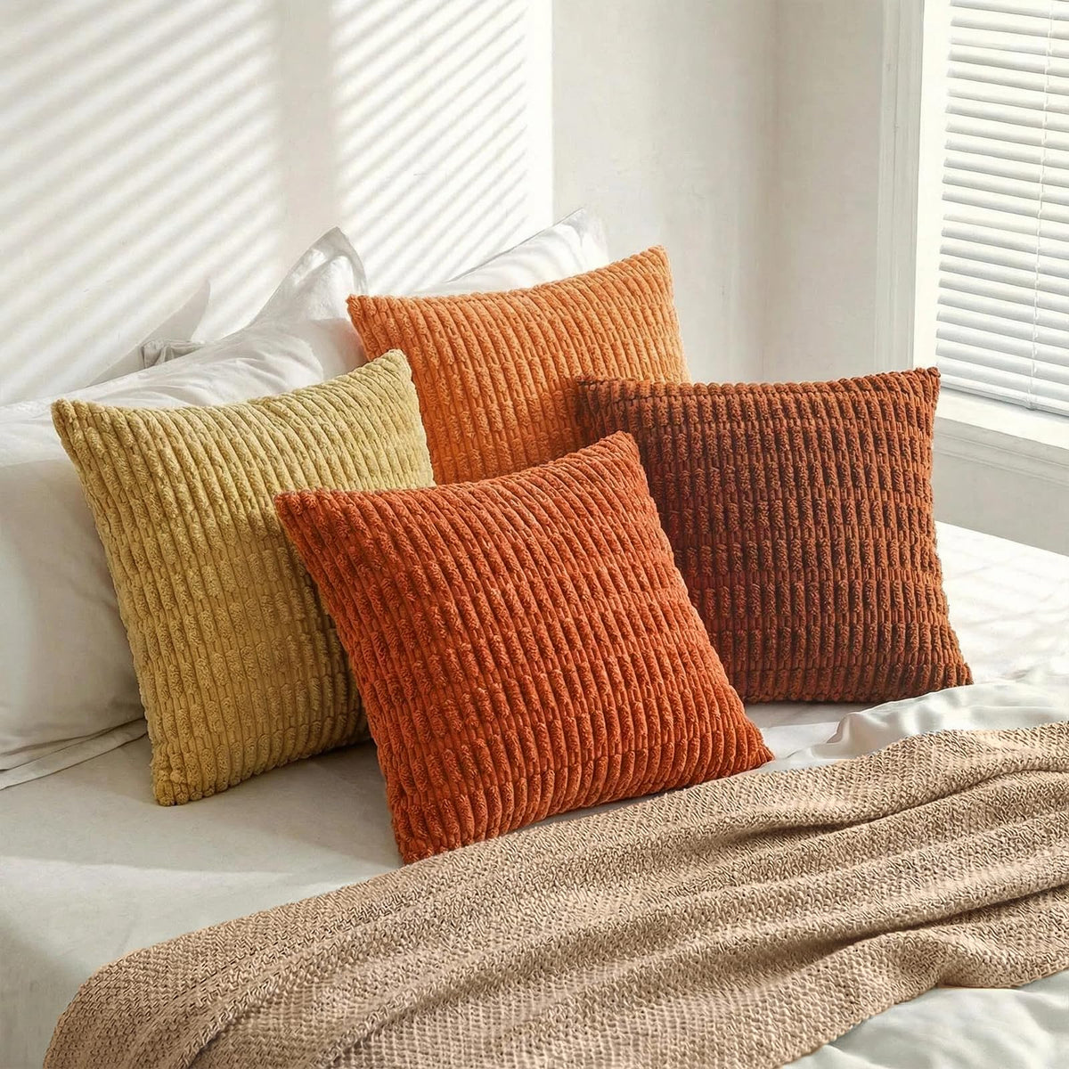 Fancy Homi burnt orange stripe pillow cover on a bedroom setting