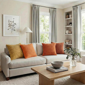 Fancy Homi burnt orange stripe pillow cover in a living room setup