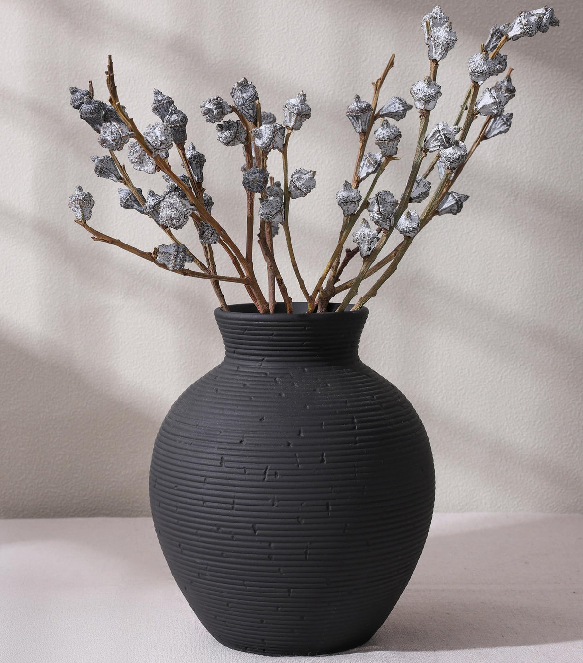 FancyPlus ceramic flower vase in black, 7.4 inches, ideal centerpiece for tables