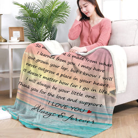 Cozy Fastpeace mom blanket on sofa for family snuggle