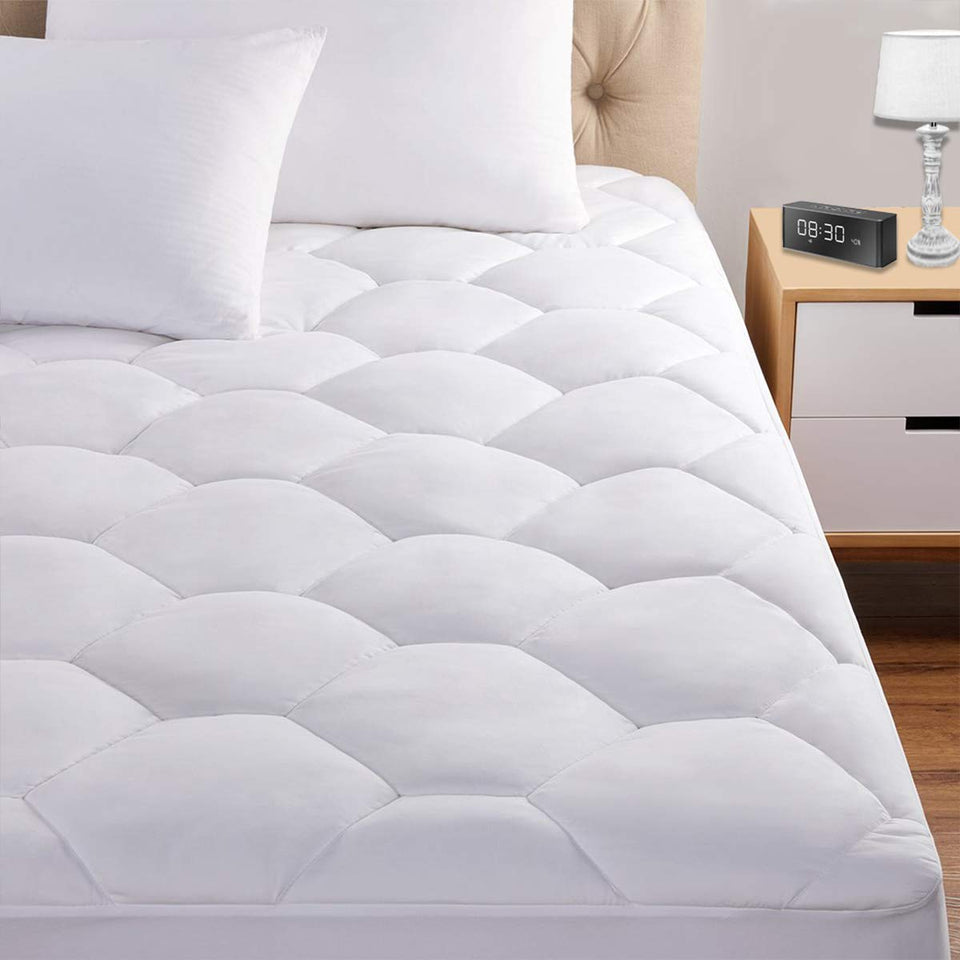 Favorland King mattress pad on bed with secure 8-21 inch depth fit.