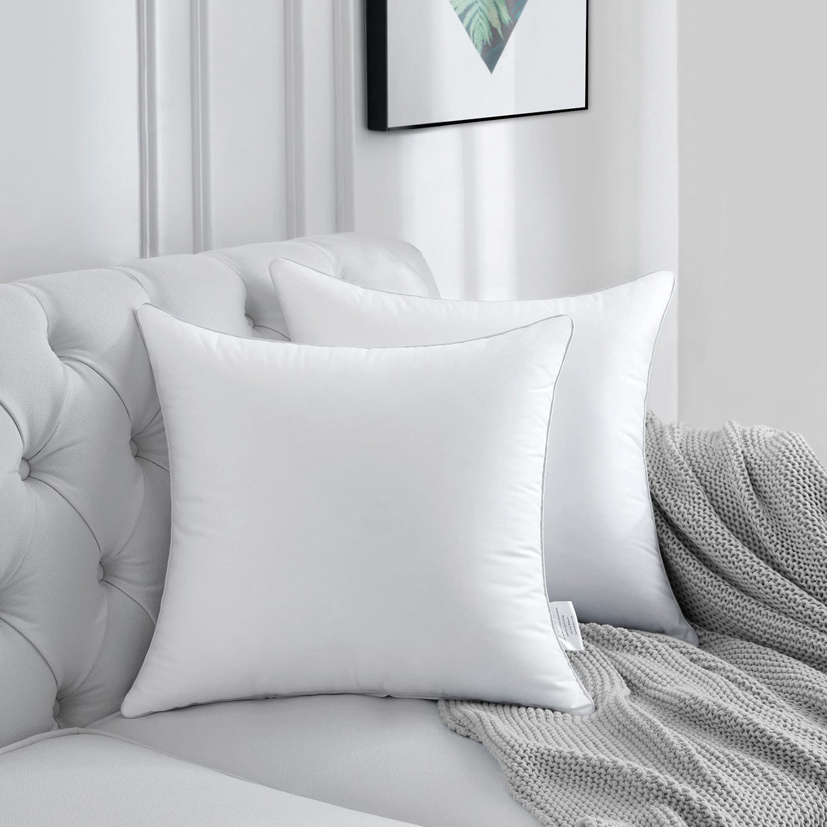 FAVRIQ set of 2 pillow inserts presented in a decorative pillow.
