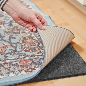 Fchuswty waterproof rug pad top view shows cushioning and size suitability for a 7x9 ft rug