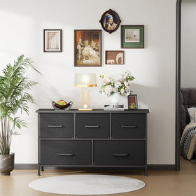 FDW 5-Drawer Dresser assembly with included tools and instructions.