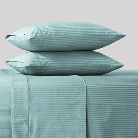 Feather & Stitch New York 500 TC cotton closeup highlighting long-staple softness and sateen shine.