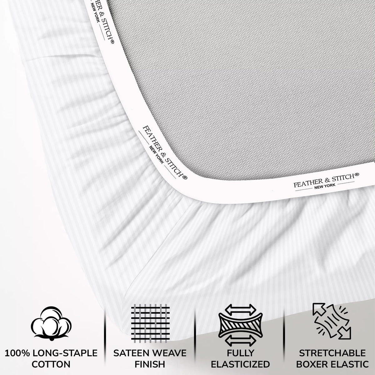 FEATHER & STITCH NEW YORK bed-scene with white stripe sheets.