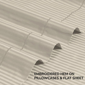 Feather & Stitch New York pillowcases feature embroidery for refined style.