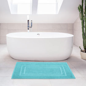 Feather & Stitch New York aqua bath mat in vibrant shade