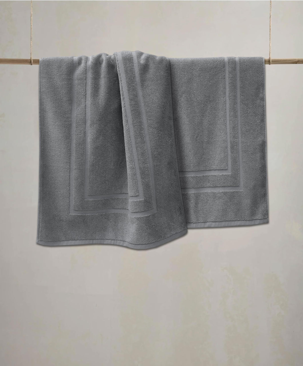 Feather & Stitch New York mat's 1000 GSM fabric showing absorbency in action