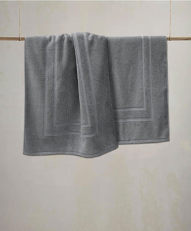 Feather & Stitch New York mat's 1000 GSM fabric showing absorbency in action