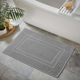 Feather & Stitch New York plush bath mat demonstrating soft pile underfoot