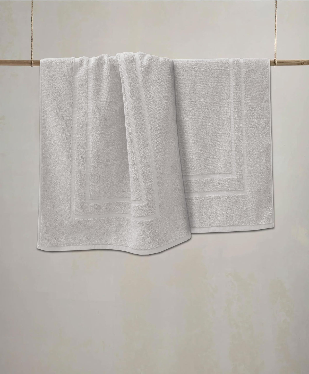 Feather & Stitch New York water-absorbent mat in bathroom, keeps floors dry.