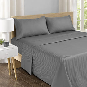 Feather & Stitch New York embroidered pillowcases add refined hotel-inspired flair