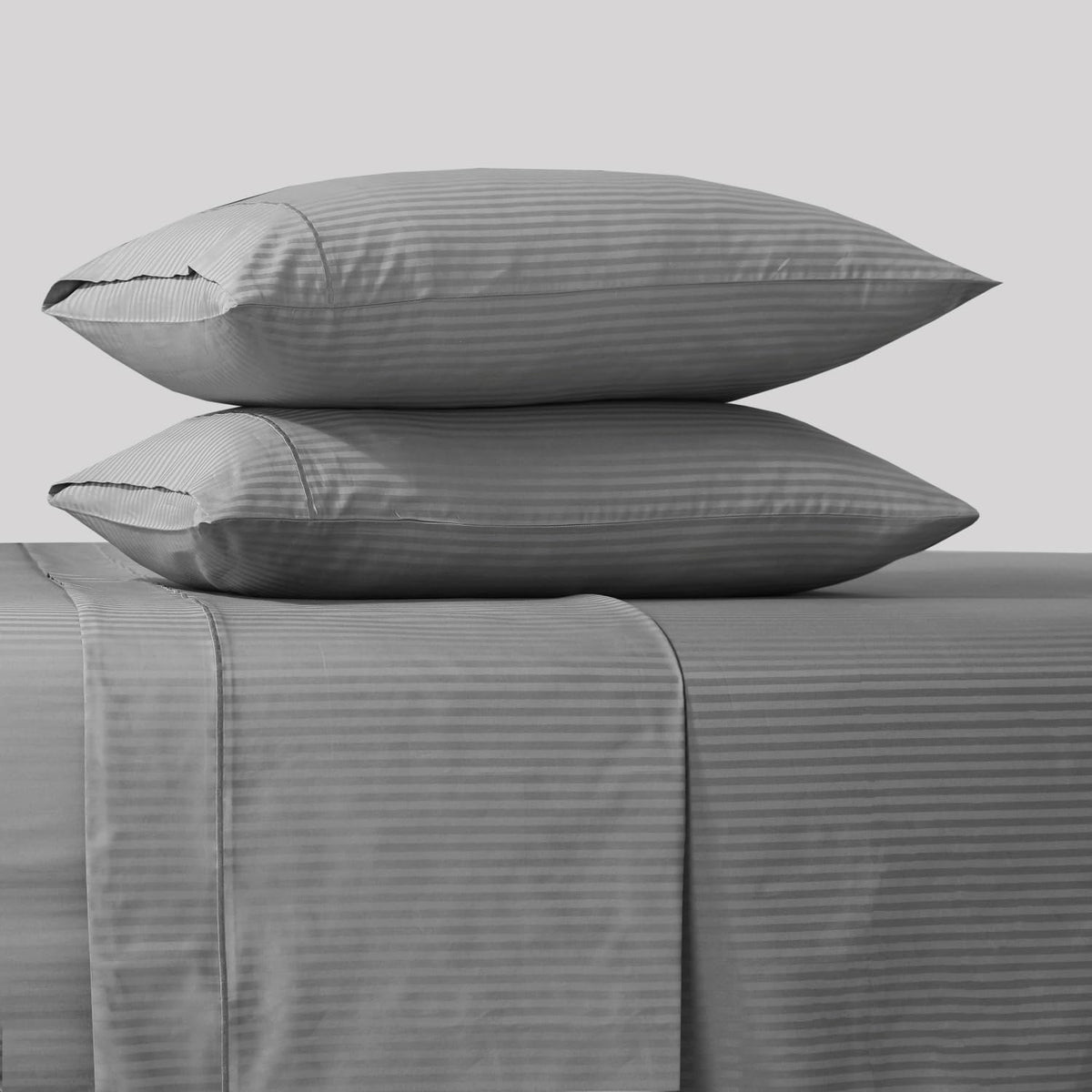 Feather & Stitch New York sateen striped sheets deliver silky softness and lasting color