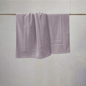 Close-up of plush cotton terry on Feather and Stitch New York bath mat 30x21 in.