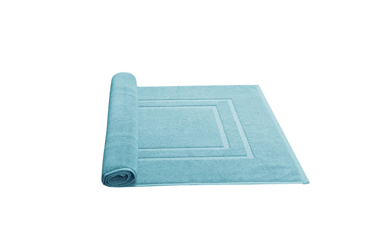 Feather & Stitch New York two-piece bath mat set shown in a bright bathroom