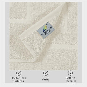 FEATHER & STITCH NEW YORK two-piece bath mat set provides coordinated bath comfort.