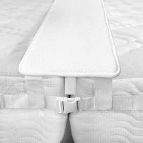FeelAtHome bed bridge assembly showing two twins joined for a seamless king-sized sleep surface.