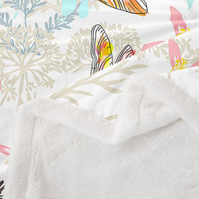 Feelyou Dragonfly throw on a bed setup, adds texture and color.