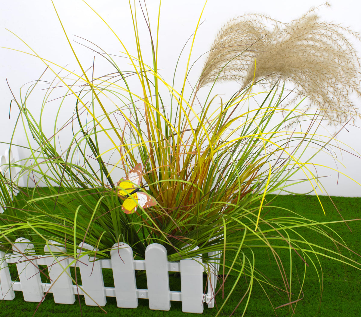 FeiLix faux grass stems sway gently in a breeze.