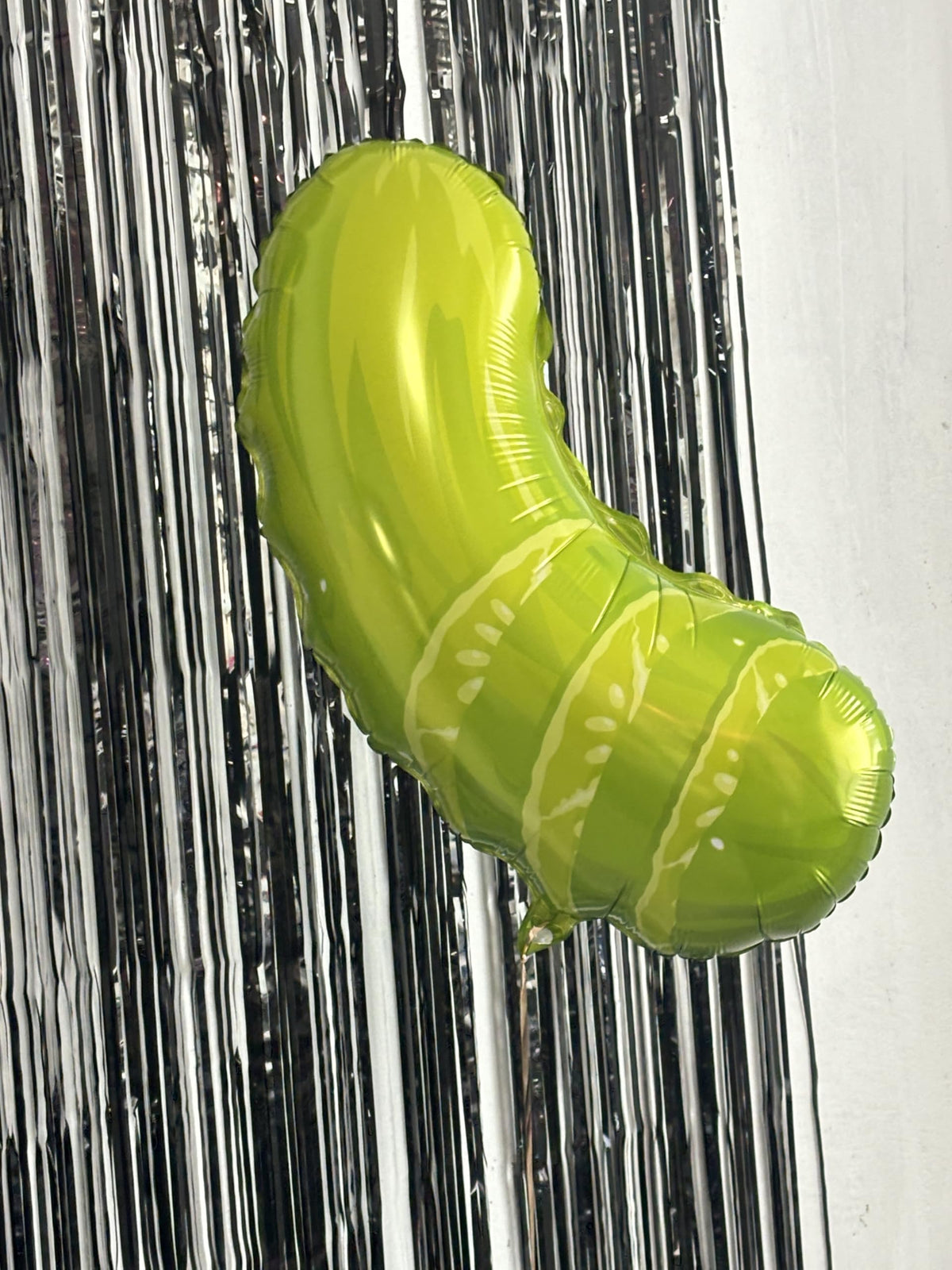 Fêteclairre ribbons add coordinated color accents to the pickle party setup.