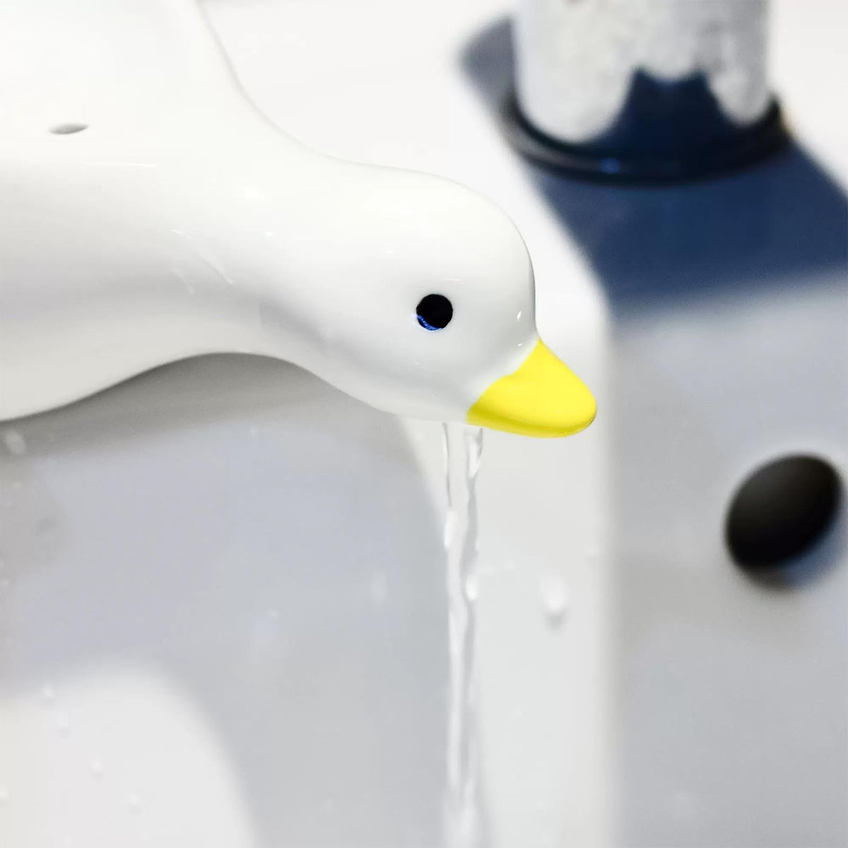 Fewile duck decor soap dish enhances bathroom aesthetics and function.