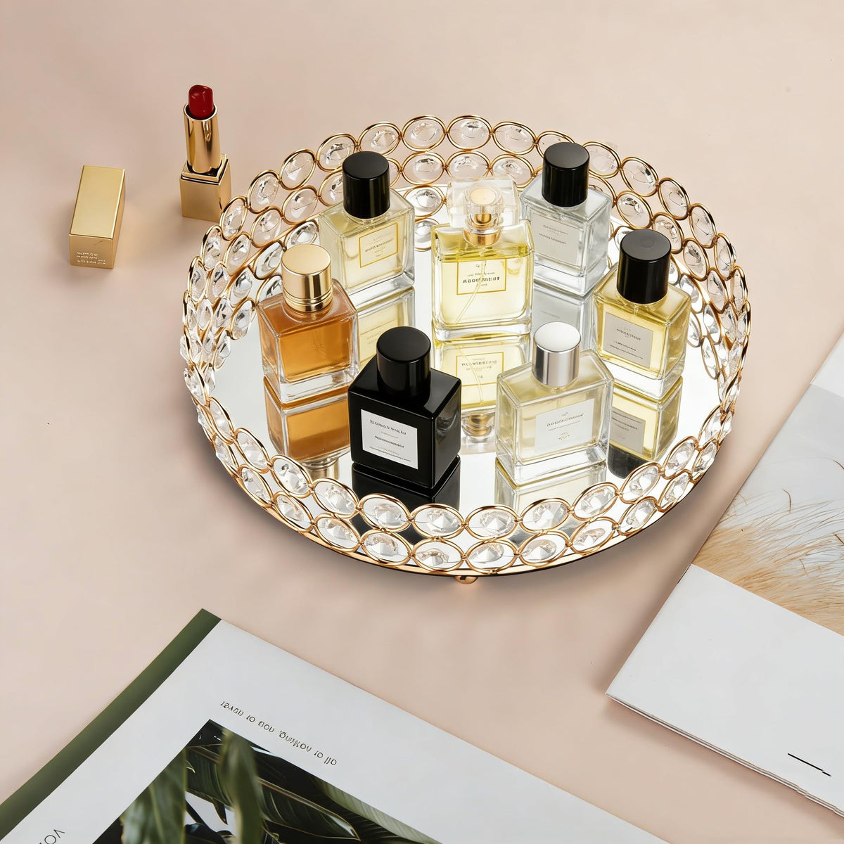 Feyarl round gold tray reflects light to highlight your fragrances.