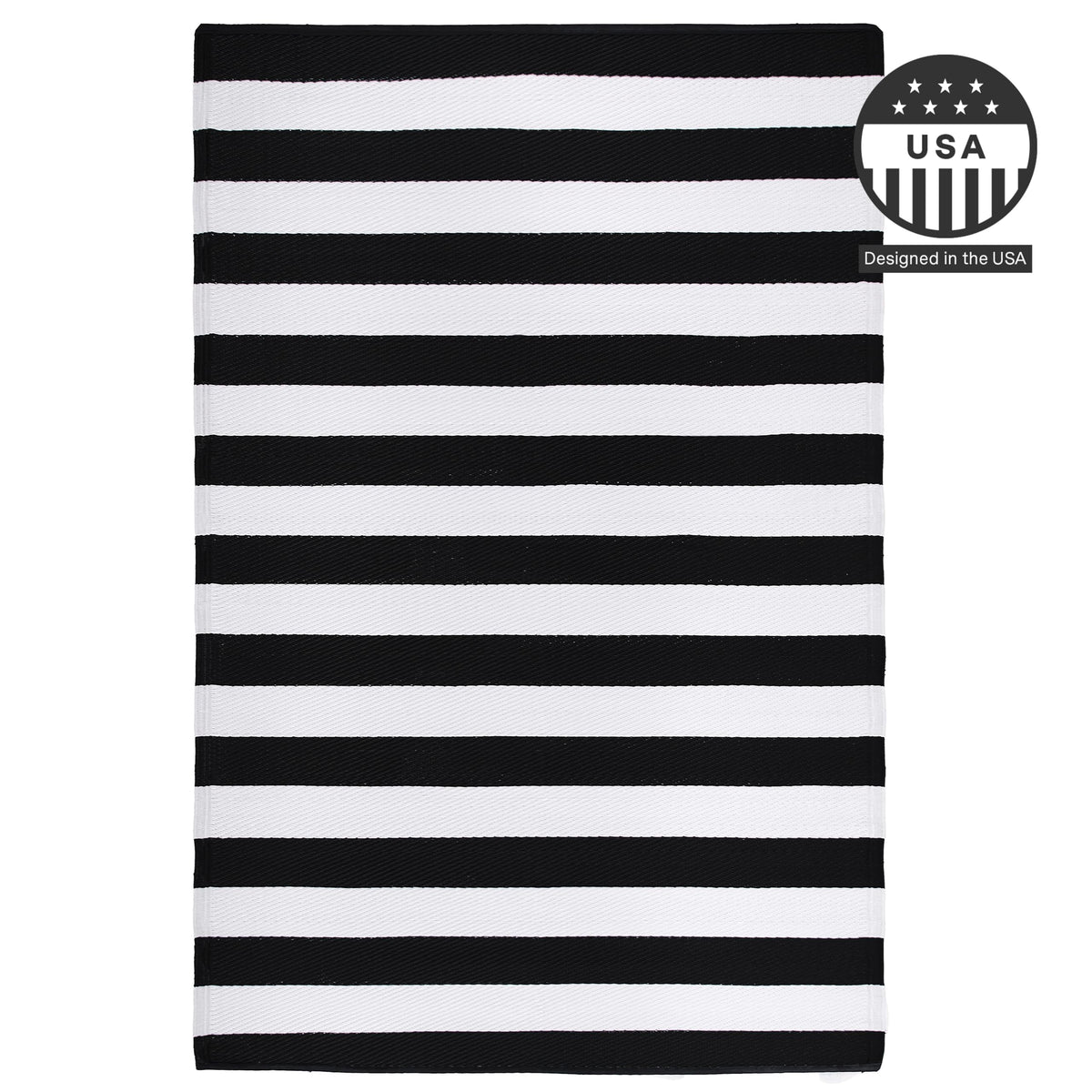 FH Home Brittany rug rolled for storage with elastic bands