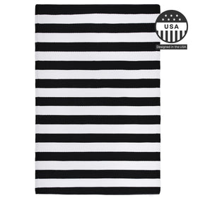 FH Home Brittany rug rolled for storage with elastic bands