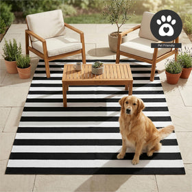 FH Home Brittany striped rug on balcony with urban view