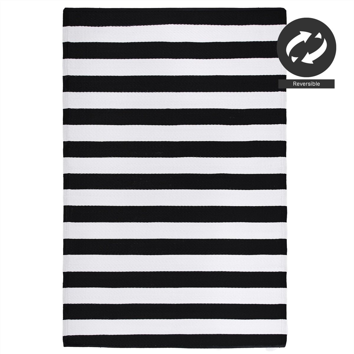 FH Home Brittany striped rug on deck beside chairs and plants