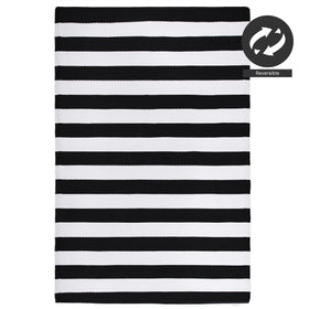 FH Home Brittany striped rug on deck beside chairs and plants