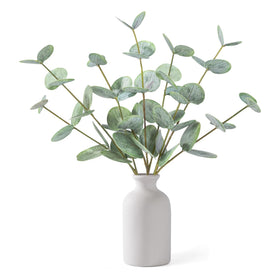 FIACO artificial eucalyptus stems in a white ceramic vase for timeless decor.