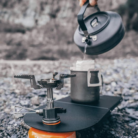 Fire-Maple Petrel table on campsite provides stable meal-prep surface.