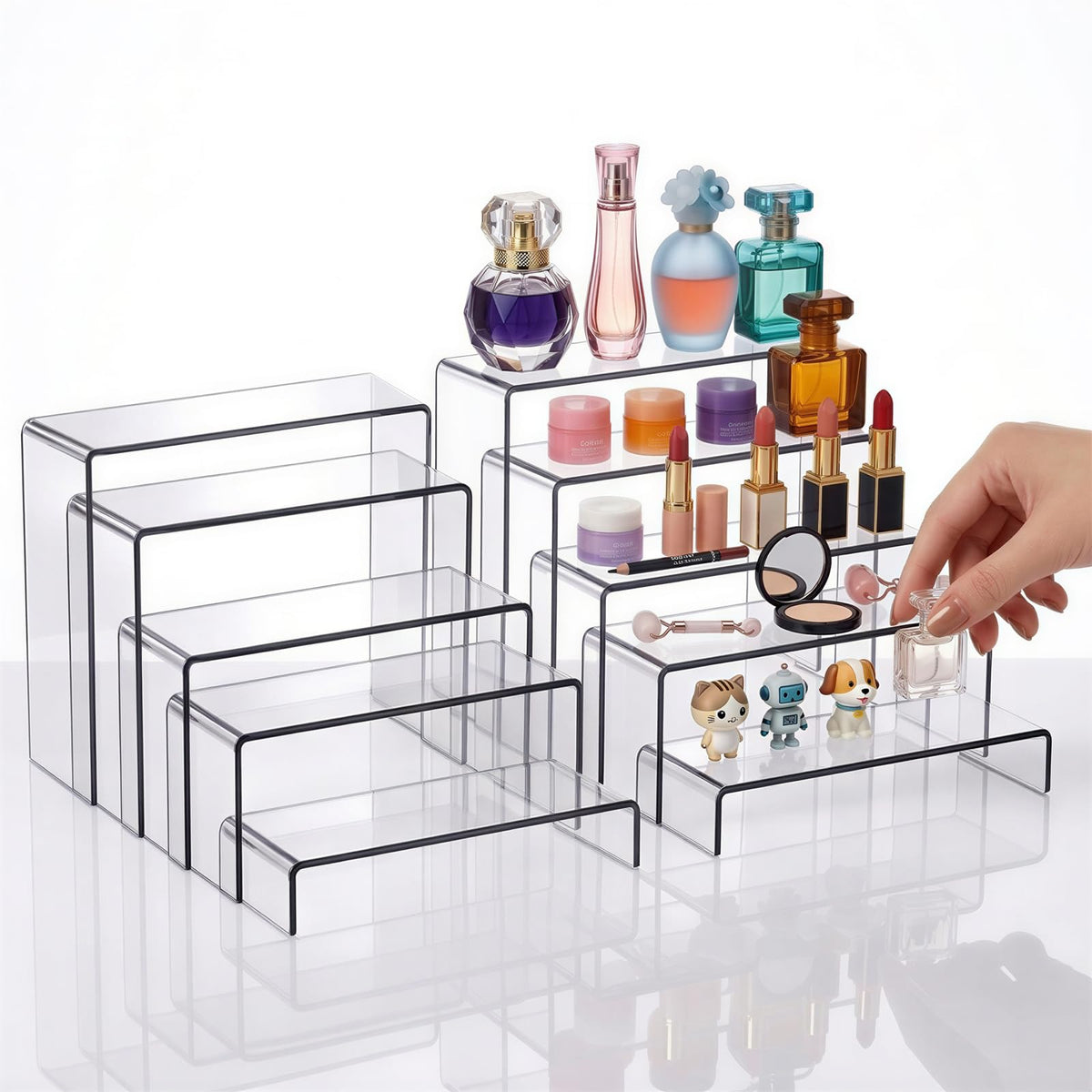 Fixwal acrylic risers showcase figurines and cupcakes with elegant layered presentation